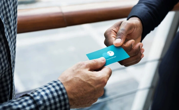  Handing - Over - Business - Card - 700x430